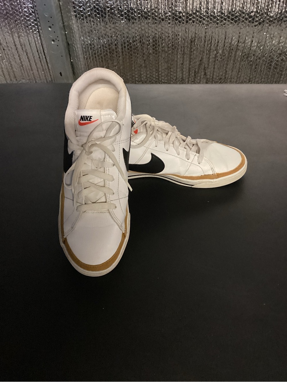 Nike White Low-Top Sneakers with Black Swoosh and Gum Trim